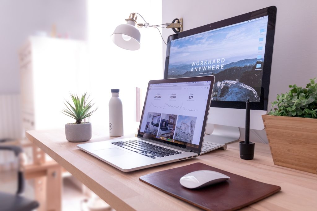 Laptop and monitor on a tidy desk